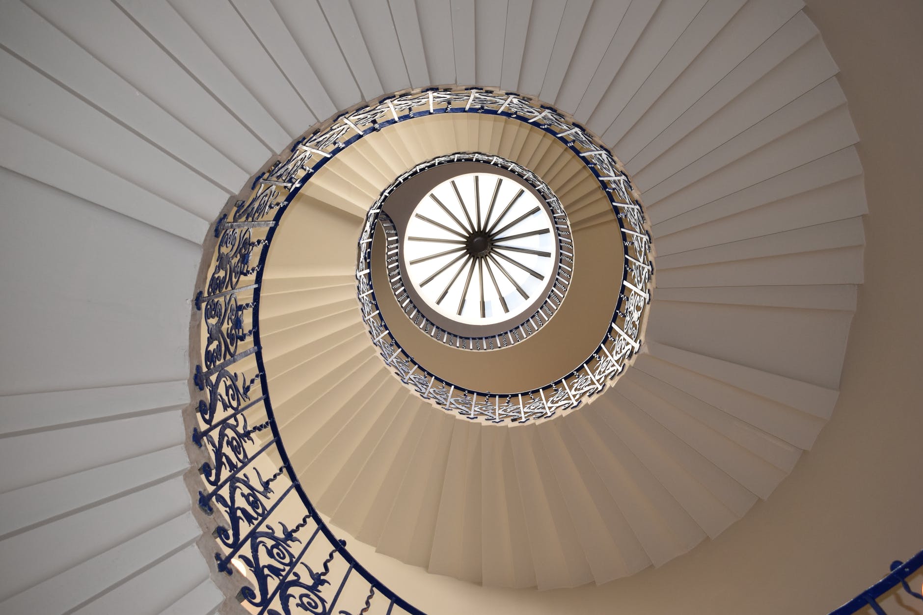 white concrete spiral stairway